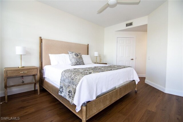 bedroom featuring ceiling fan and dark hardwood / wood-style flooring