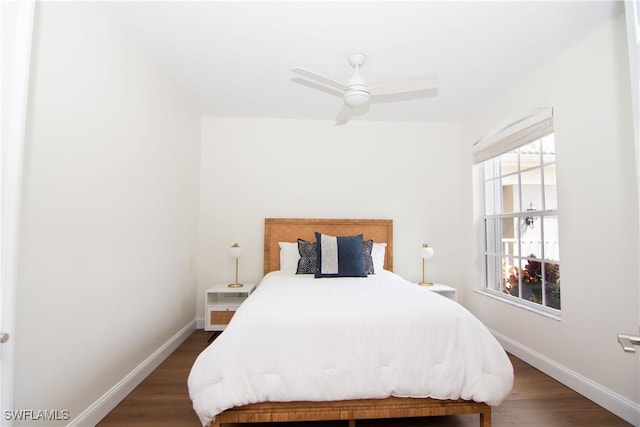 bedroom with ceiling fan and dark wood-type flooring