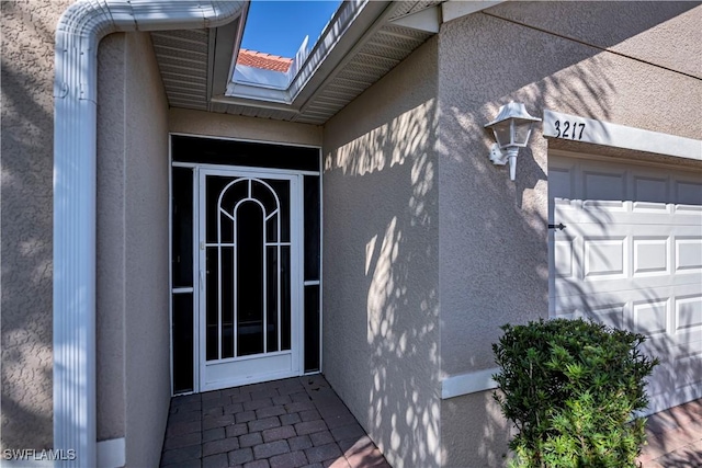 property entrance featuring a garage