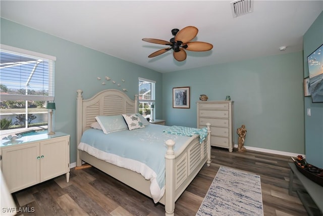 bedroom featuring ceiling fan and dark hardwood / wood-style floors