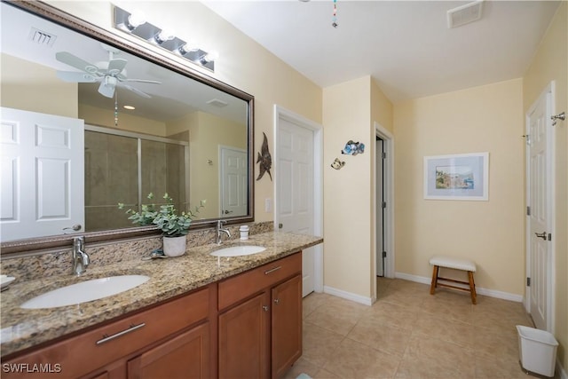 bathroom featuring tile patterned flooring, vanity, ceiling fan, and walk in shower