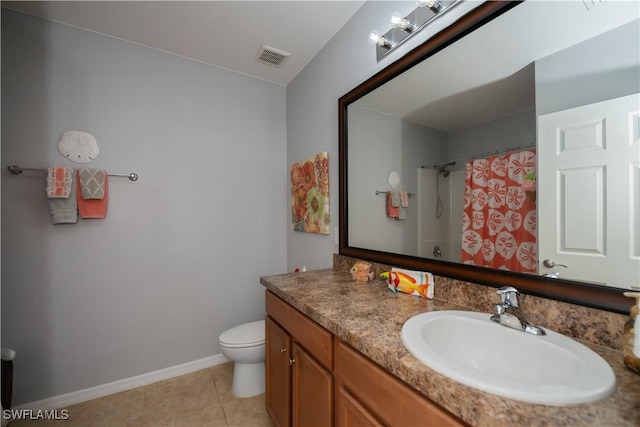 bathroom featuring tile patterned flooring, a shower with curtain, vanity, and toilet