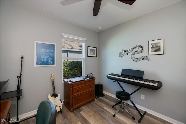 misc room with ceiling fan and light hardwood / wood-style flooring