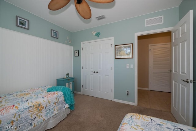 bedroom featuring carpet flooring, a closet, and ceiling fan