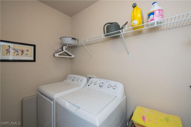 laundry room with washing machine and dryer