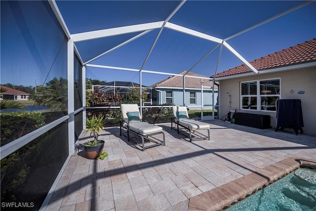 view of patio / terrace featuring a lanai