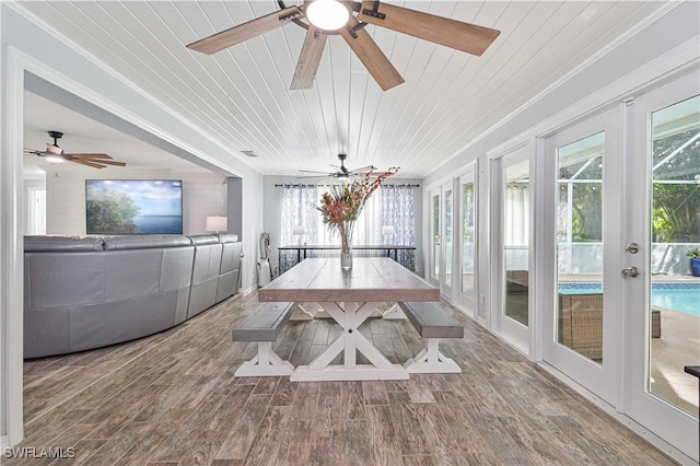 unfurnished sunroom with wood ceiling and french doors