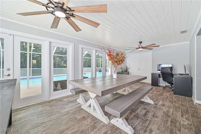 dining area featuring ceiling fan, crown molding, french doors, and wooden ceiling