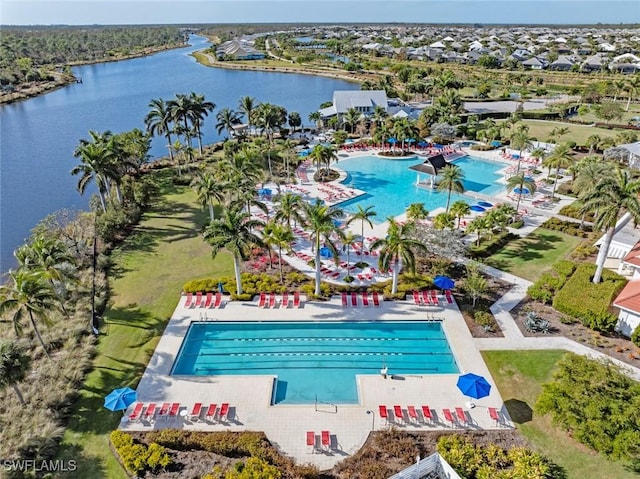 birds eye view of property with a water view