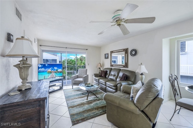 tiled living room with ceiling fan