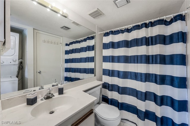 bathroom with a shower with curtain, a textured ceiling, stacked washer / drying machine, toilet, and vanity