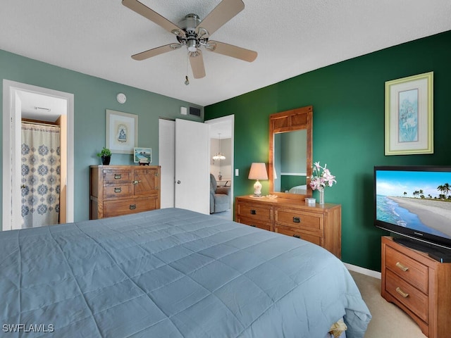 carpeted bedroom with a textured ceiling, a closet, and ceiling fan