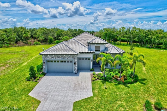 view of front of home featuring a garage and a front yard