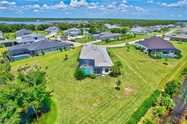 drone / aerial view with a water view