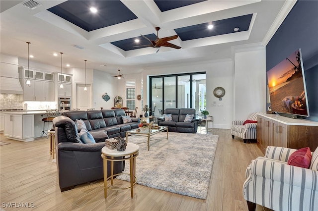 living room with ceiling fan, coffered ceiling, beamed ceiling, crown molding, and light hardwood / wood-style floors