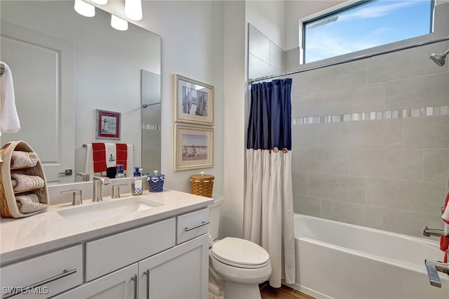 full bathroom with vanity, toilet, and shower / bathtub combination with curtain