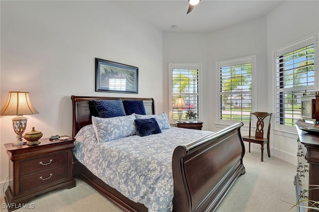 carpeted bedroom with ceiling fan