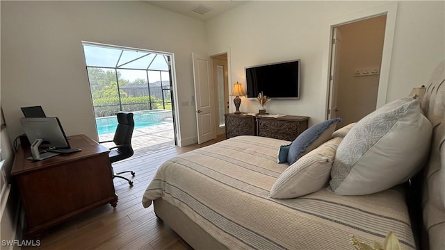 19749 Panther Island Blvd, Estero, FL 33928 - bedroom featuring access to outside, wood finished floors, an office area, and a sunroom