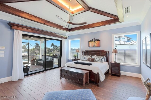 bedroom featuring ceiling fan, access to exterior, and crown molding