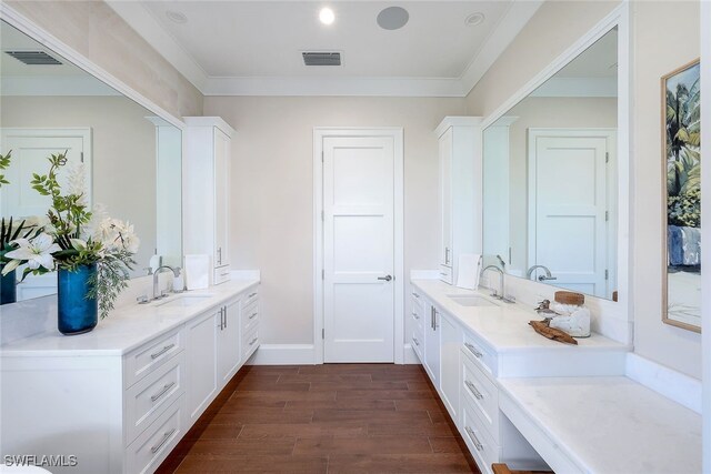 mudroom with crown molding and sink