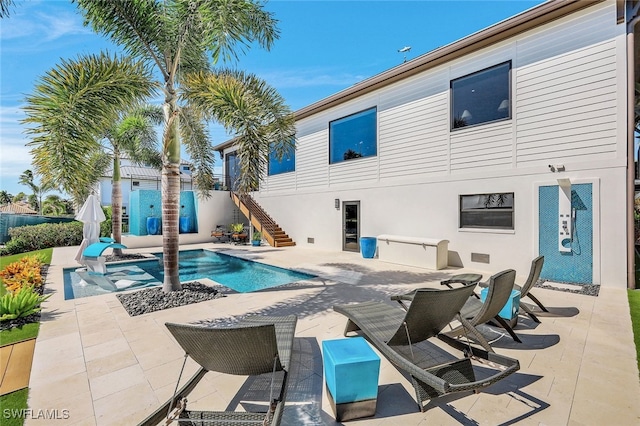 view of swimming pool featuring a patio