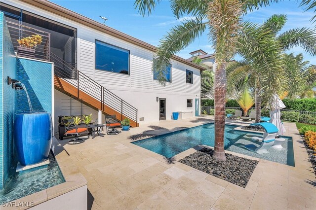 view of swimming pool with a patio