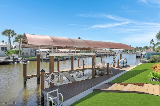 dock area with a yard and a water view