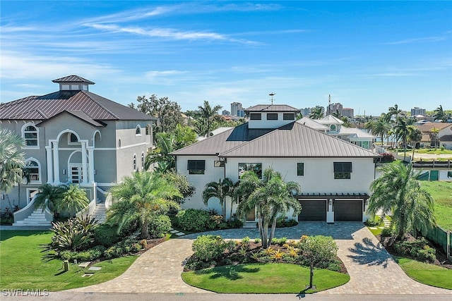 view of front of home featuring a garage and a front lawn