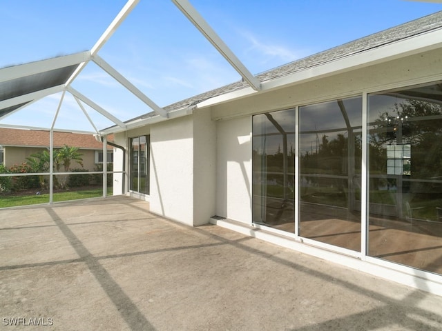 view of patio / terrace featuring a lanai