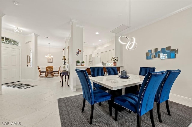 dining room with an inviting chandelier, crown molding, and light tile patterned flooring