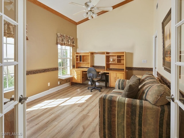 home office with high vaulted ceiling, light wood-type flooring, french doors, and crown molding