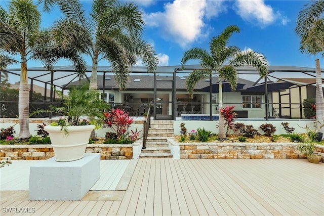 rear view of house featuring a lanai