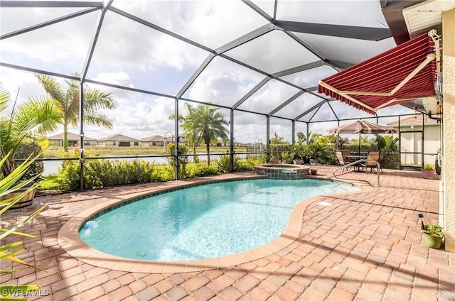 view of pool with glass enclosure, an in ground hot tub, and a patio