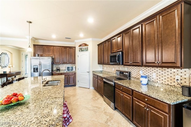 kitchen featuring sink, ornamental molding, decorative light fixtures, and appliances with stainless steel finishes