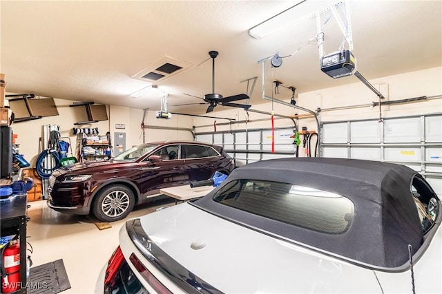 garage featuring ceiling fan and a garage door opener