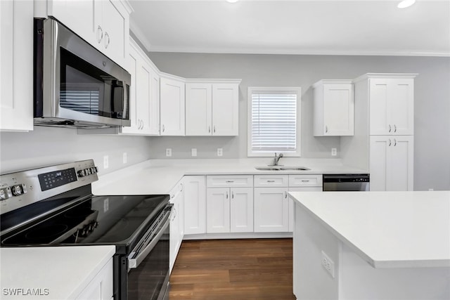 837 Da Vinci Ave S, Lehigh Acres, FL 33974 - kitchen featuring crown molding, light countertops, appliances with stainless steel finishes, white cabinetry, and a sink