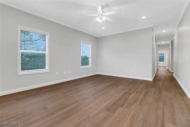 837 Da Vinci Ave S, Lehigh Acres, FL 33974 - empty room featuring ceiling fan, recessed lighting, wood finished floors, baseboards, and crown molding