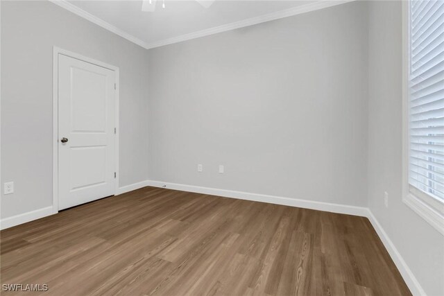 837 Da Vinci Ave S, Lehigh Acres, FL 33974 - unfurnished room featuring crown molding, ceiling fan, wood finished floors, and baseboards