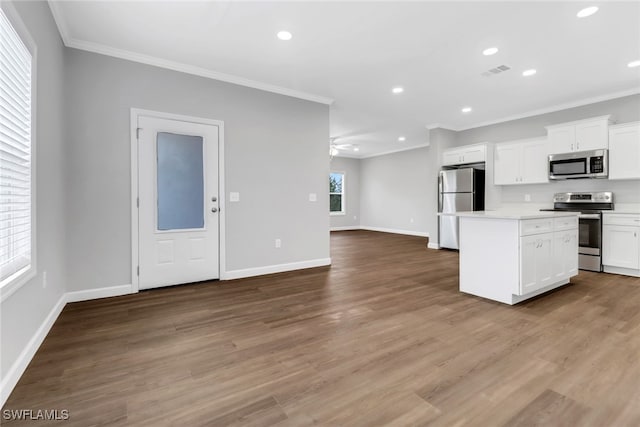 837 Da Vinci Ave S, Lehigh Acres, FL 33974 - kitchen featuring visible vents, white cabinets, appliances with stainless steel finishes, a center island, and light countertops