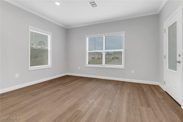 837 Da Vinci Ave S, Lehigh Acres, FL 33974 - unfurnished room featuring a healthy amount of sunlight, baseboards, and visible vents