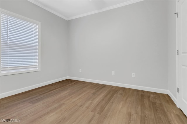 837 Da Vinci Ave S, Lehigh Acres, FL 33974 - spare room featuring ornamental molding, light wood-type flooring, and baseboards
