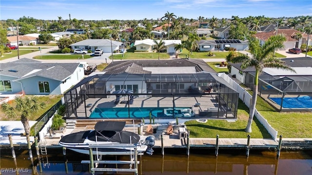 drone / aerial view with a residential view and a water view