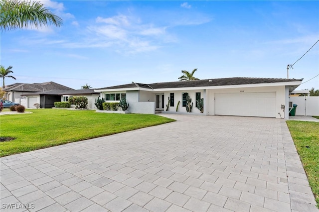 single story home with a front lawn and a garage