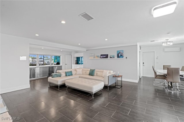 living room with a wall mounted AC and wine cooler