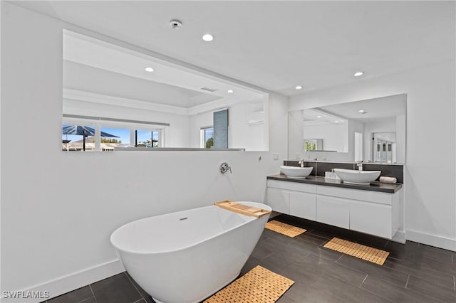 bathroom with a bathing tub and vanity