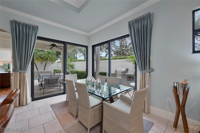 dining room featuring ceiling fan, light tile patterned flooring, and ornamental molding