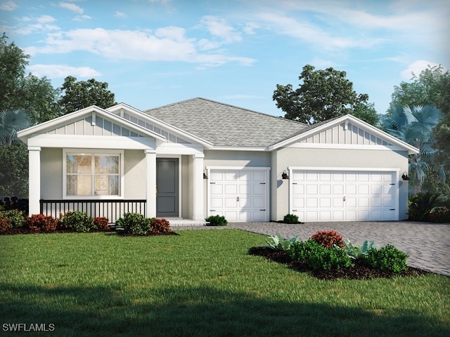 view of front of property featuring a porch, a front lawn, and a garage