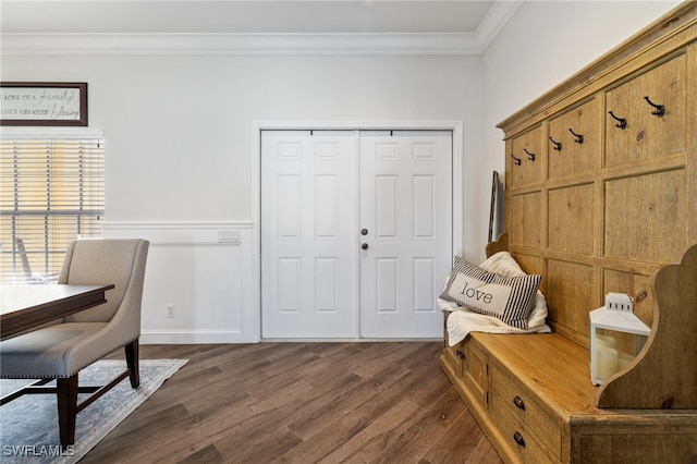 interior space with dark hardwood / wood-style floors and crown molding