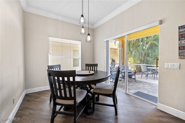 dining space with a healthy amount of sunlight, dark hardwood / wood-style flooring, and crown molding