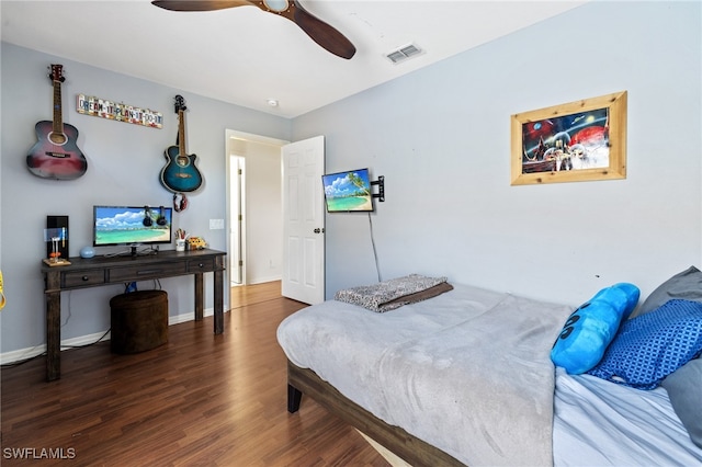 bedroom featuring ceiling fan and dark hardwood / wood-style flooring